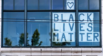 Black Lives Matter sign in office window